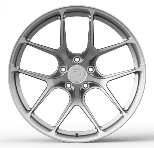 Silver car wheel rim on a white background