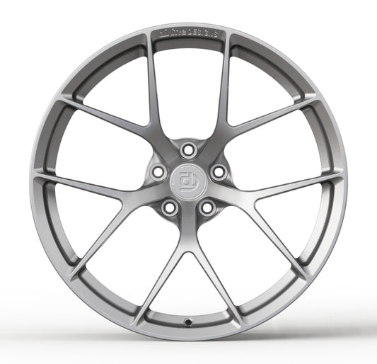 Car wheel rim with a brand logo on a white background