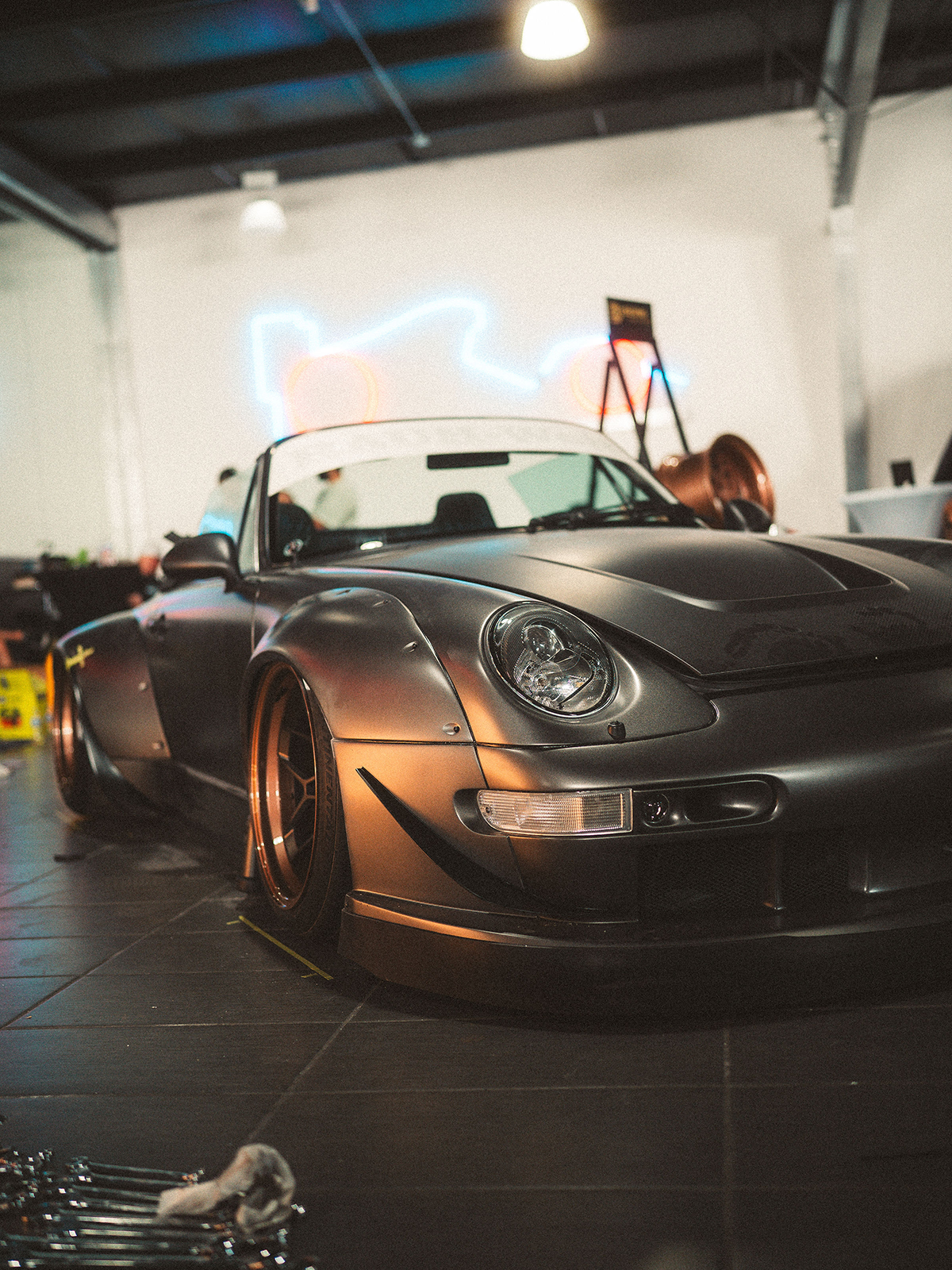 Silver sports car in a garage setting
