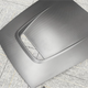 Carbon fiber hood on a textured gray surface