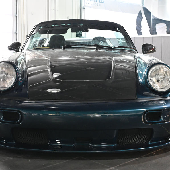 Blue sports car in a showroom setting