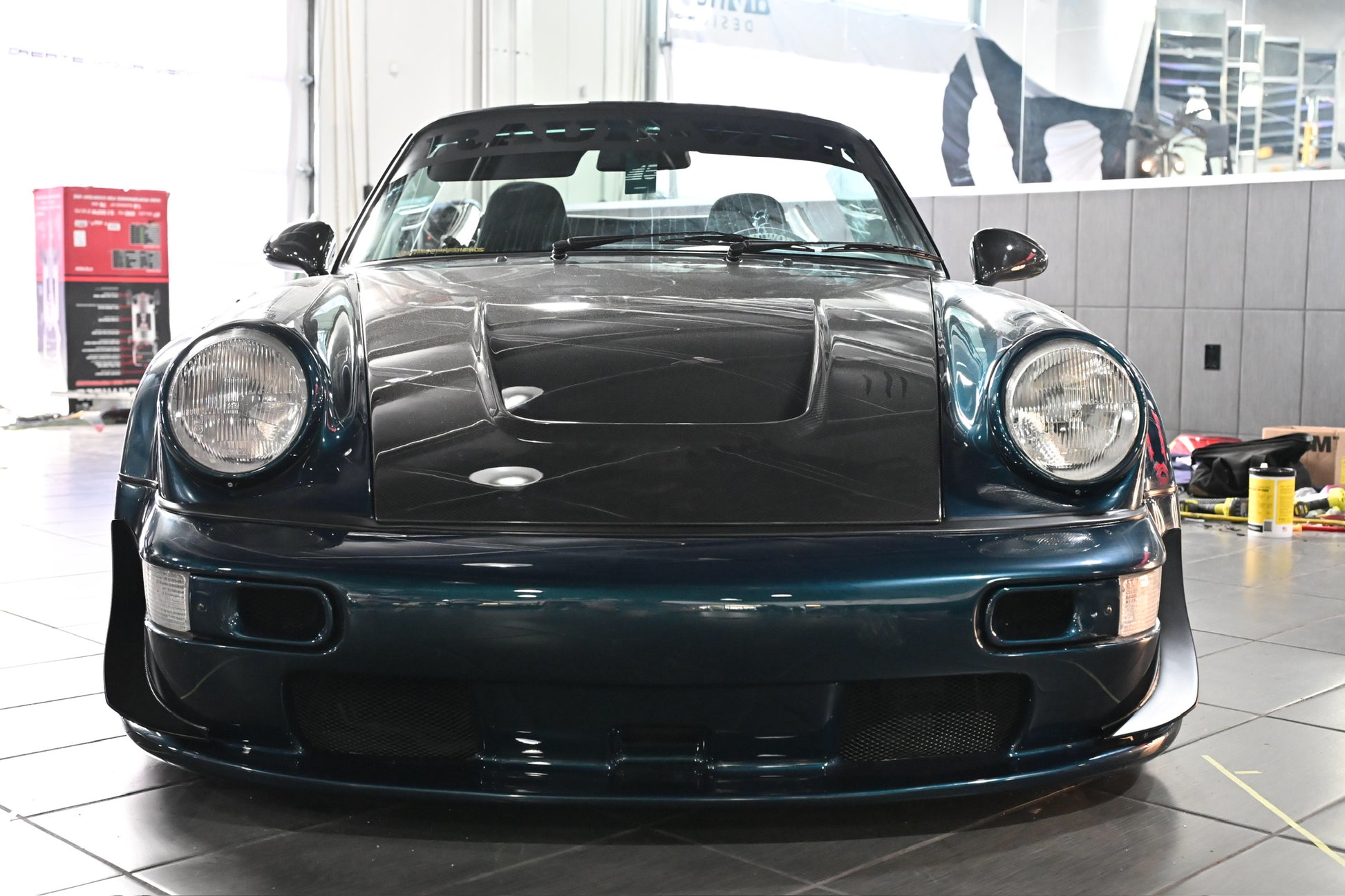 Blue sports car in a showroom setting