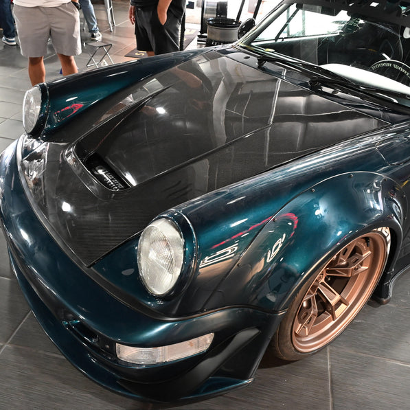 Luxury car with bronze rims on a tiled floor