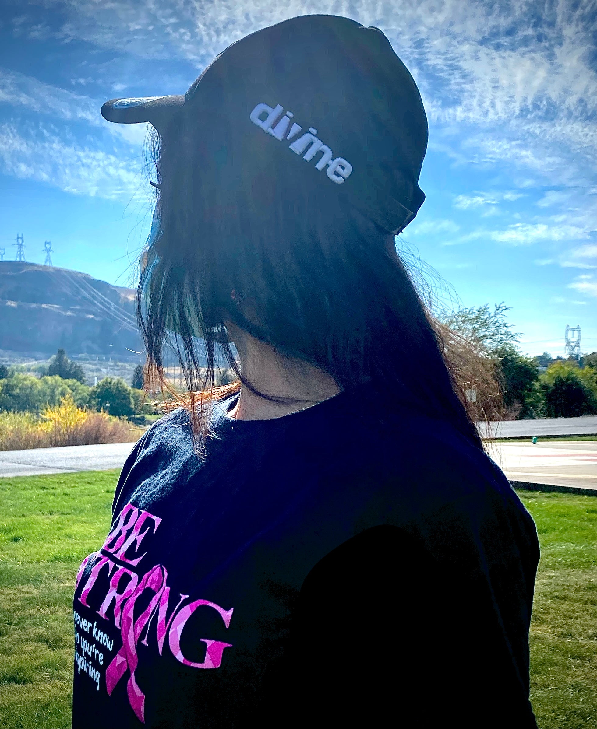 Woman wearing Divine Designs hat