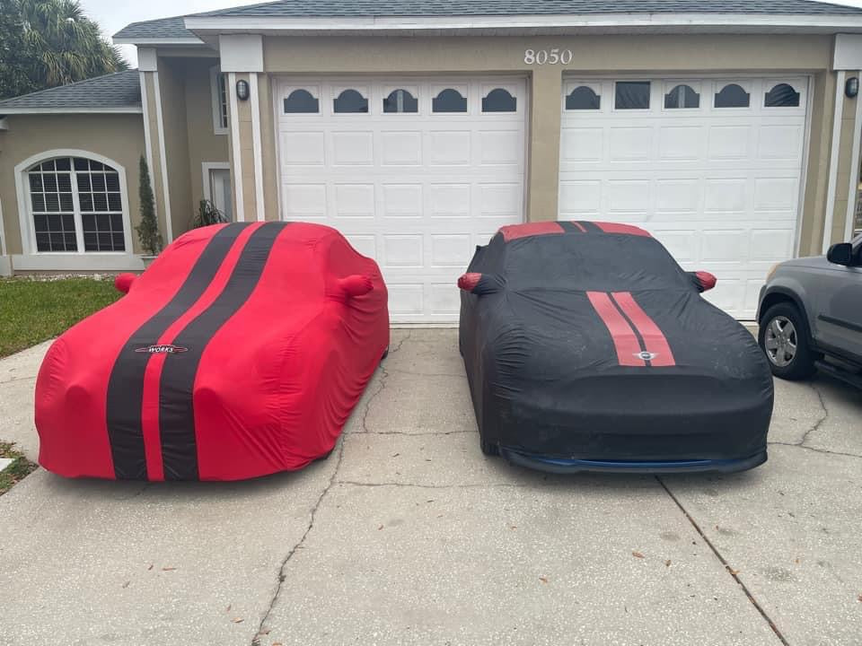 Two Ford Mustangs with custom covers