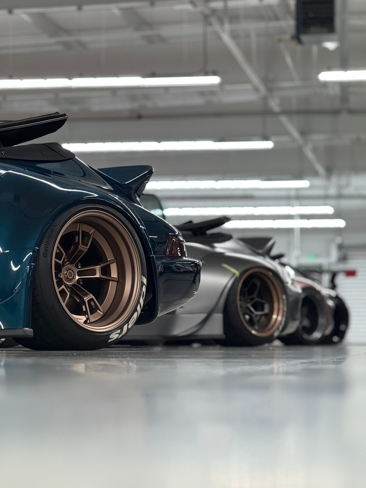 Row of high-performance cars in a garage