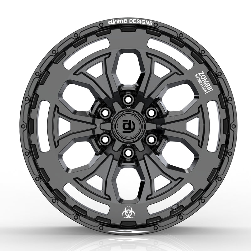 Black alloy wheel with 'divine DESIGNS' branding on a white background