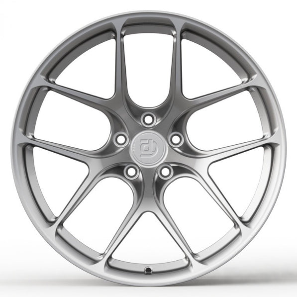 Silver car wheel rim on a white background