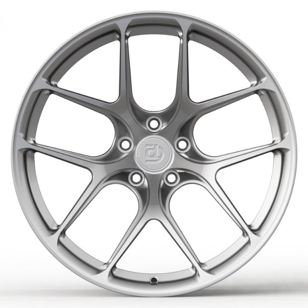 Silver car wheel rim on a white background