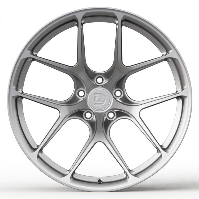 Silver car wheel rim on a white background