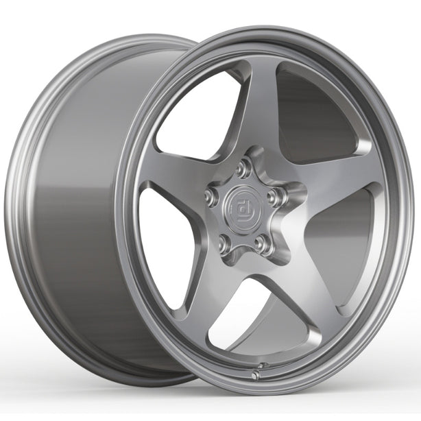 Silver alloy wheel on a white background