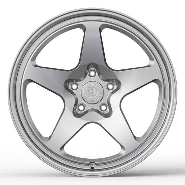 Silver alloy wheel on a white background