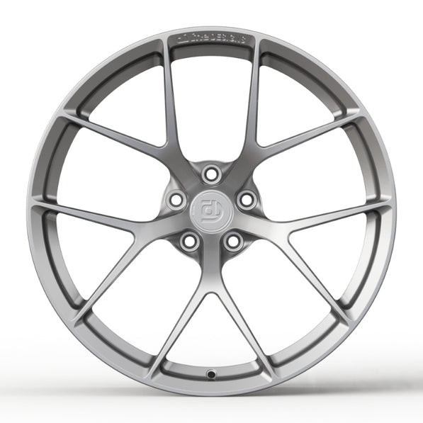 Car wheel rim with a brand logo on a white background