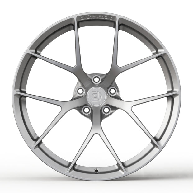 Car wheel rim with a brand logo on a white background