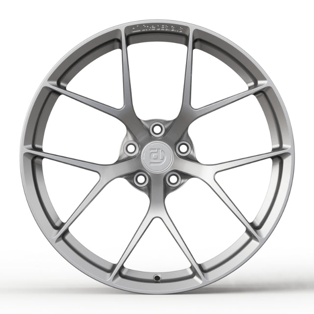 Car wheel rim with a brand logo on a white background