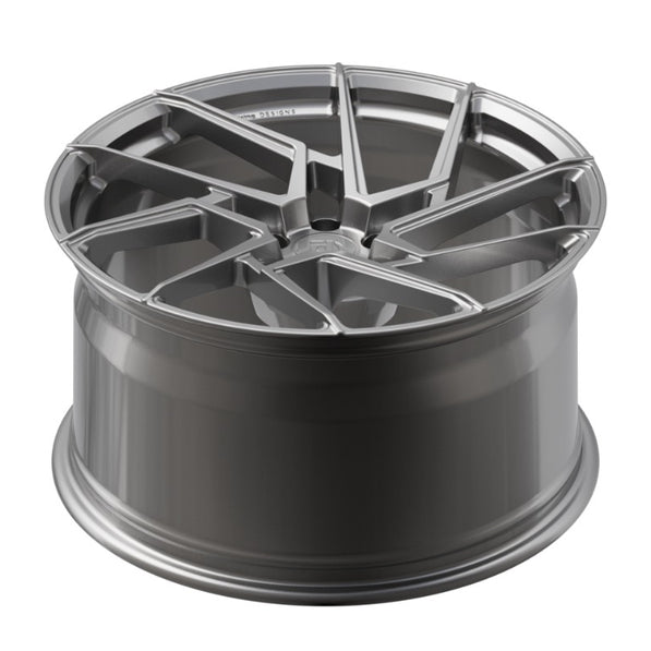 Metallic gray alloy wheel on a white background