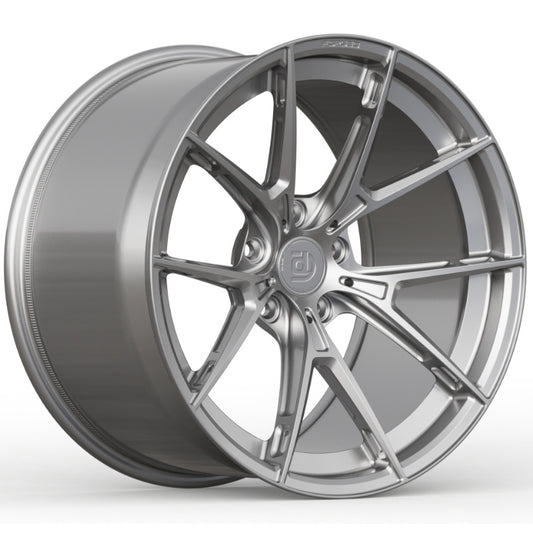 Silver alloy wheel on a white background