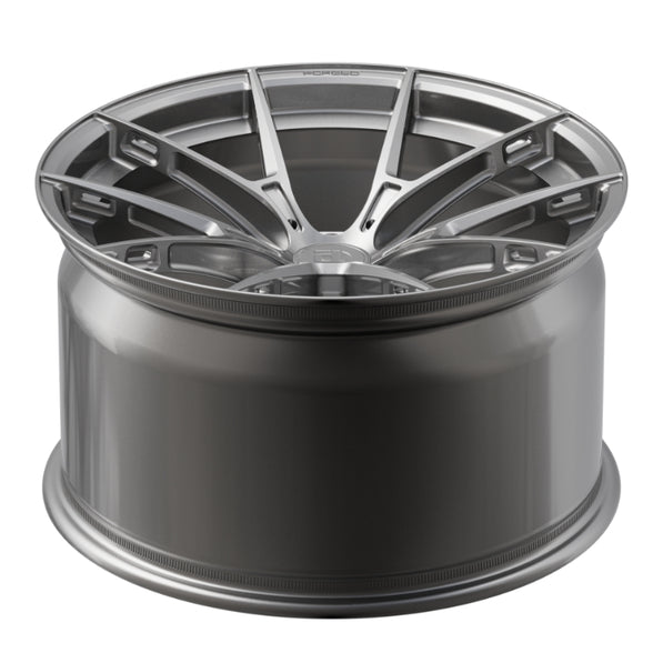 Car wheel rim with a metallic finish on a white background