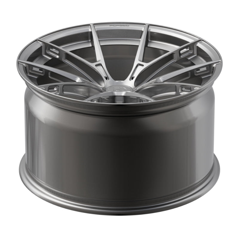 Car wheel rim with a metallic finish on a white background