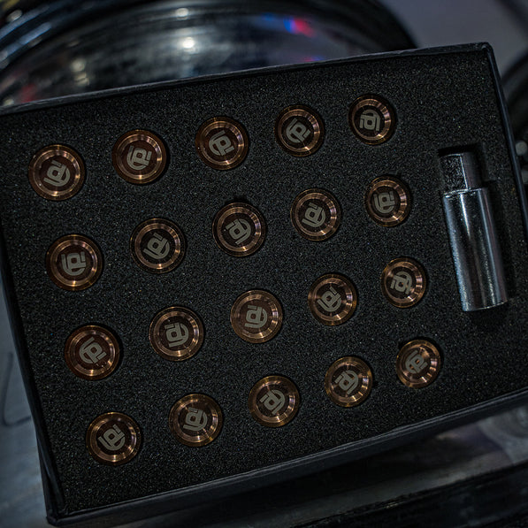 Black box with bronze branded titanium lug nuts