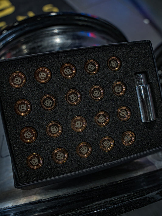 Black box with bronze branded titanium lug nuts