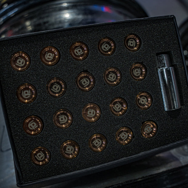 Black box with bronze branded titanium lug nuts