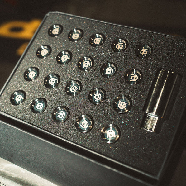 Black box with black branded titanium lug nuts