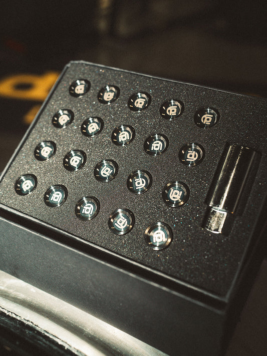 Black box with black branded titanium lug nuts