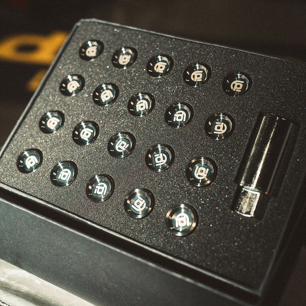 Black box with black branded titanium lug nuts