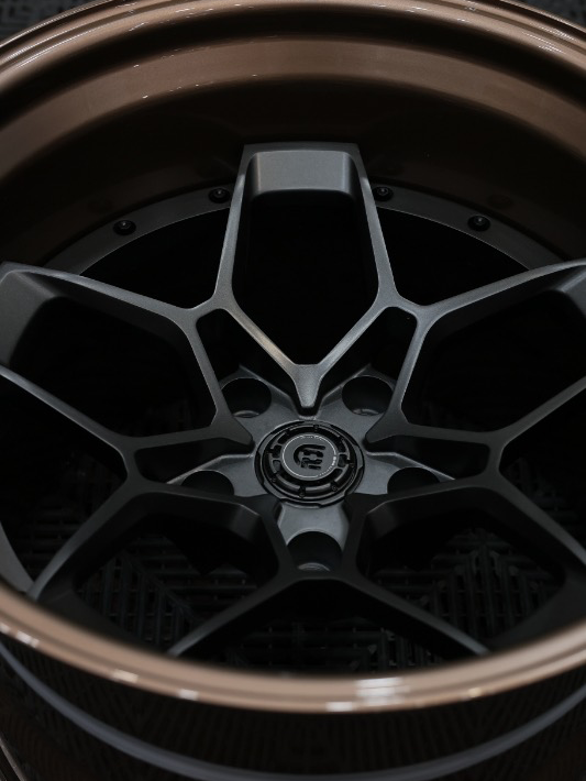 Close-up of a black wheel with a detailed design