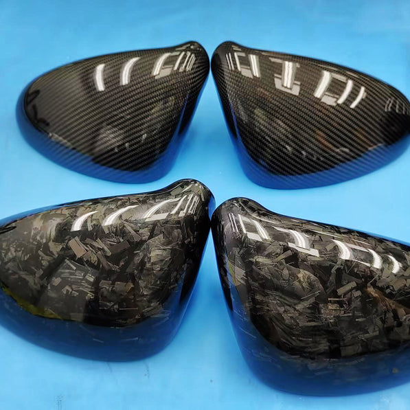 Close-up image of a one-piece seamless carbon fiber aero mirror for Porsche vehicles