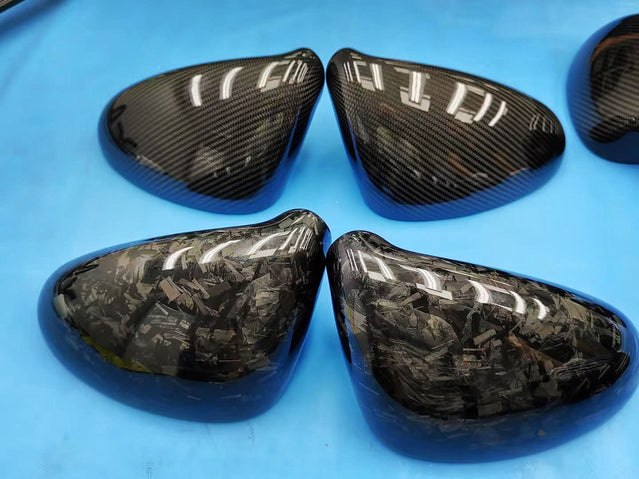 Close-up image of a one-piece seamless carbon fiber aero mirror for Porsche vehicles