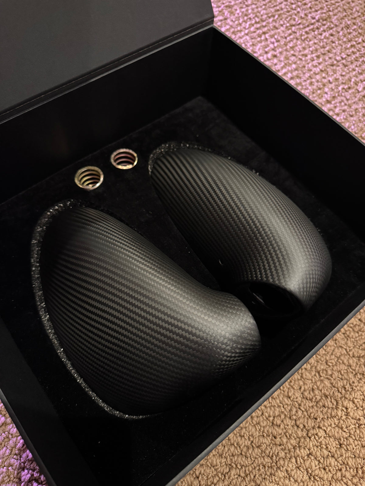 Close-up image of a one-piece seamless carbon fiber aero mirror for Porsche vehicles