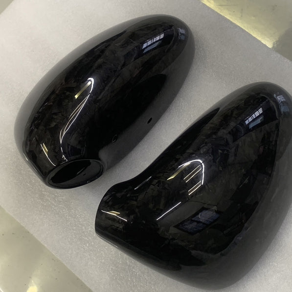 Close-up image of a one-piece seamless carbon fiber aero mirror for Porsche vehicles