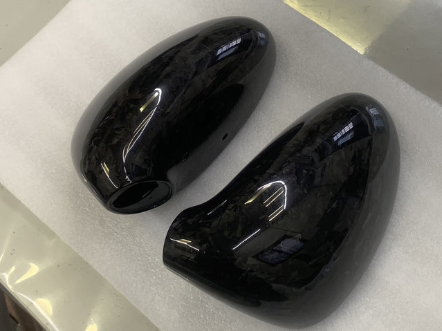 Close-up image of a one-piece seamless carbon fiber aero mirror for Porsche vehicles