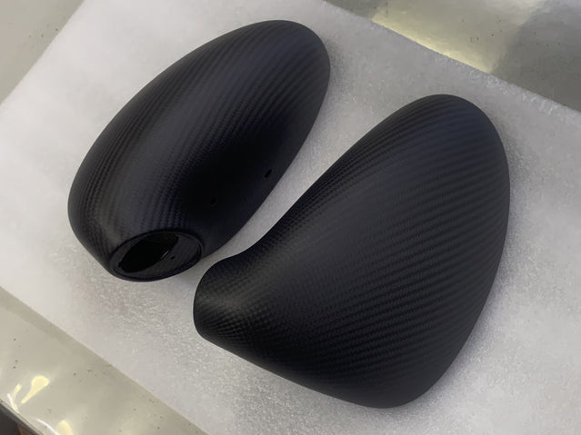 Close-up image of a one-piece seamless carbon fiber aero mirror for Porsche vehicles