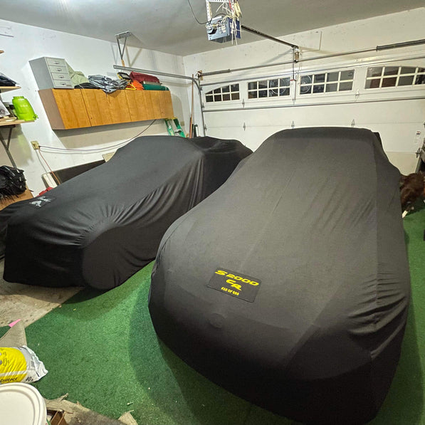 Two Honda s2000s with Custom Logo Covers