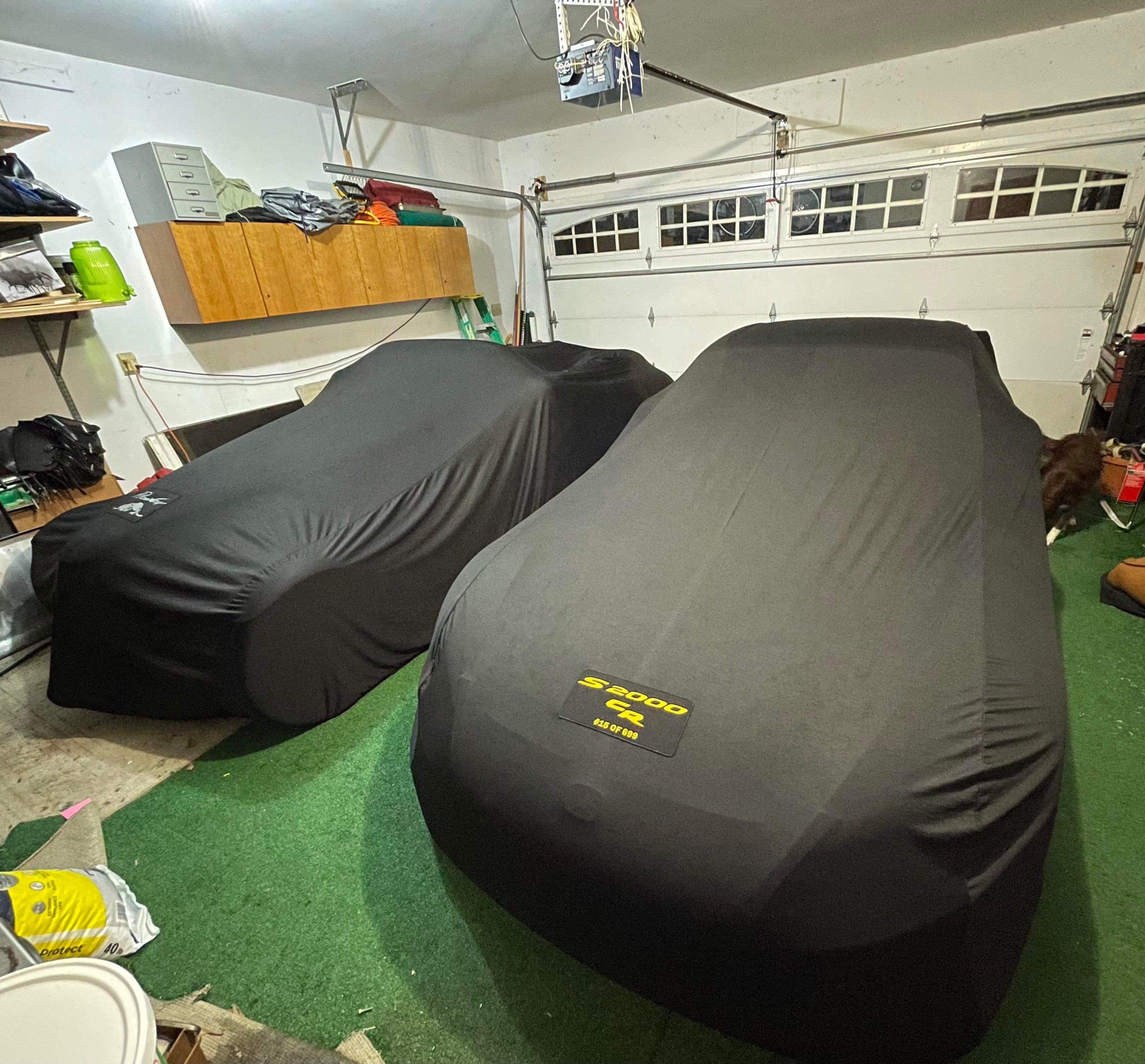 Two Honda s2000s with Custom Logo Covers