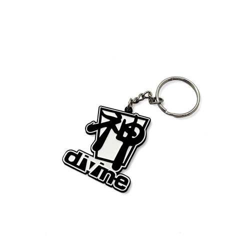 A black and white metal keychain with the word 'DIVINE' inscribed on it.